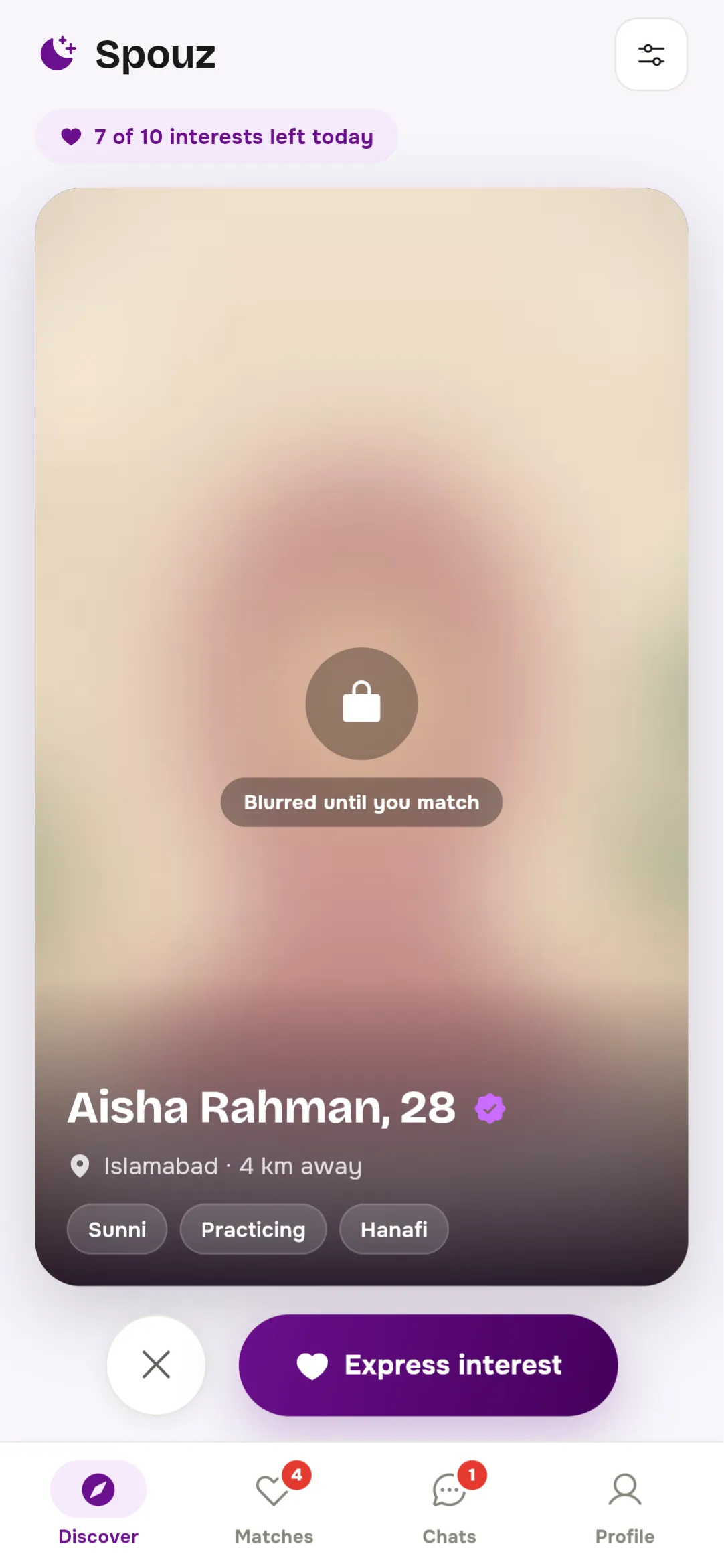The Discover tab in Spouz, showing a member’s profile card with her photo blurred until you match